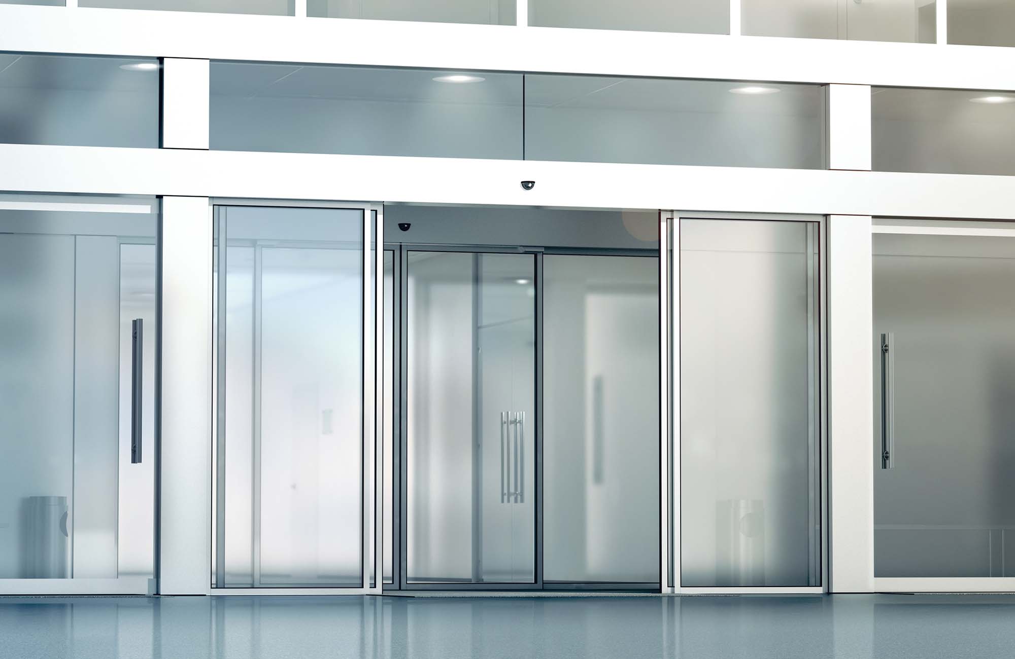 Blank sliding glass doors entrance mockup, 3d rendering. Commercial automatic slide entry mock up. Office building exterior template. Closed transparent business centre facade, front view.